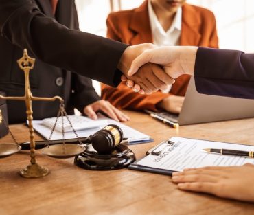 Shaking,Hands,,Lawyers,Offer,Legal,Guidance,,Stand,For,Clients,In