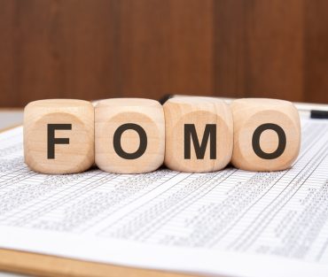 Close-up,Of,Wooden,Blocks,With,The,Word,Fomo,On,A