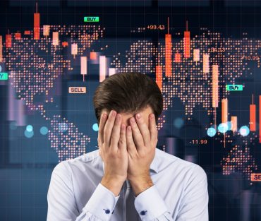 Stressed,Businessman,Covering,Face,,Red,Downward,Stock,Chart,,Digital,World